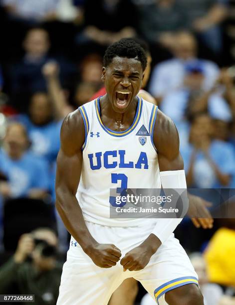 Aaron Holiday of the UCLA Bruins celebrates after making a three-pointer at the end of the National Collegiate Basketball Hall Of Fame Classic...