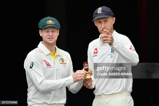 Australia's skipper Steve Smith and Joe Root, Captain of England smile as they pose at a media opportunity in Brisbane on November 22 ahead ahead of...