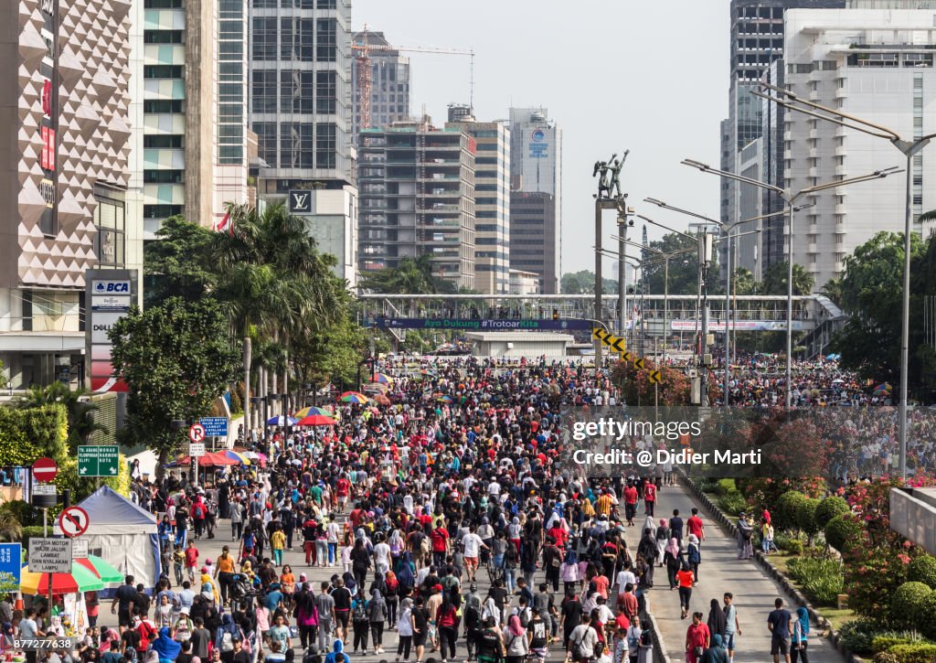 A huge crowd attends the car free day along Sudirman street in Jakarta, Indonesia capital city