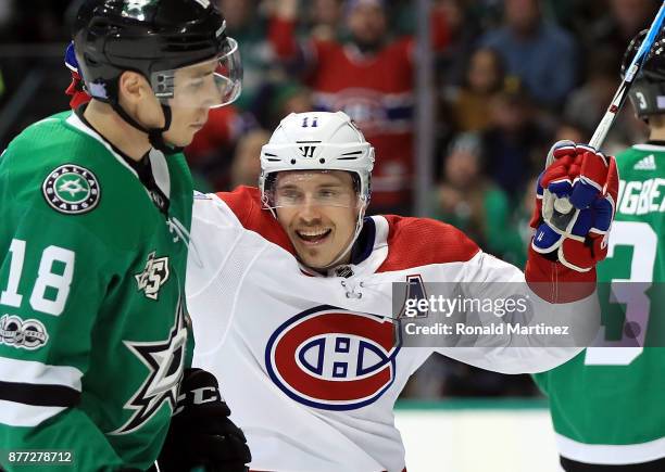 Brendan Gallagher of the Montreal Canadiens celebrates a goal in front of Tyler Pitlick of the Dallas Stars in the second period at American Airlines...