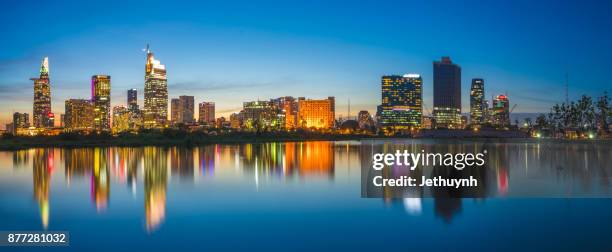 panorama ho chi minh city skyline at night riverside - ho chi minh city 個照片及圖片檔