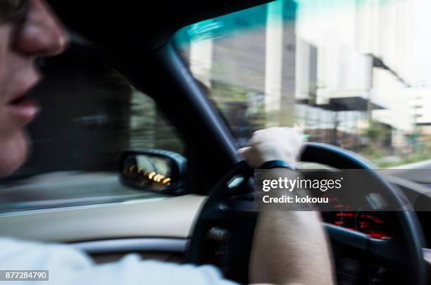 men are driving through the streets. - truck side view stock pictures, royalty-free photos & images