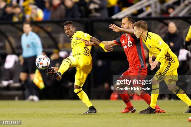 Harrison Afful of the Columbus Crew SC clears the ball away from Victor Vazquez of the Toronto FC during the second half at MAPFRE Stadium on...