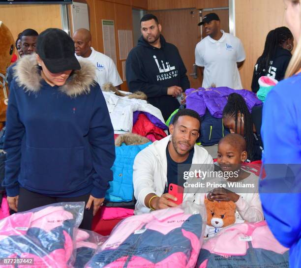 Eudoxie Bridges and Ludacris attend 2017 Ludacris Foundation Coat Giveaway at Egleston Children's Center on November 21, 2017 in Atlanta, Georgia.