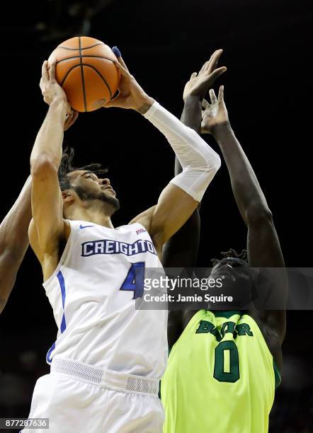 Ronnie Harrell Jr. #4 of the Creighton Bluejays shoots over Jo Lual-Acuil Jr. #0 of the Baylor Bears during the National Collegiate Basketball Hall...
