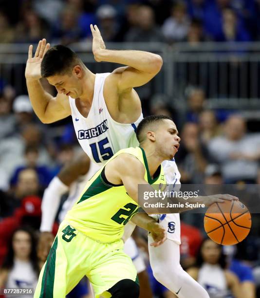 Manu Lecomte of the Baylor Bears drives as Martin Krampelj of the Creighton Bluejays defends during the National Collegiate Basketball Hall Of Fame...