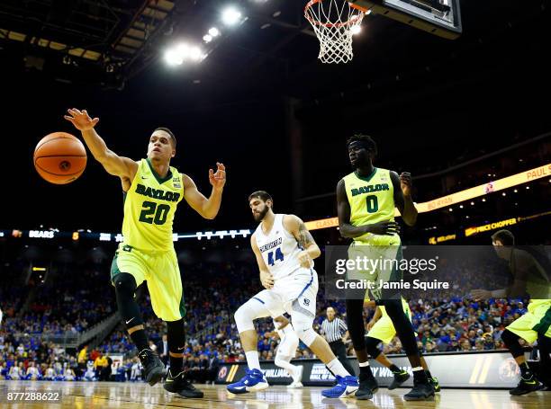 Manu Lecomte of the Baylor Bears lunges for a loose ball during the National Collegiate Basketball Hall Of Fame Classic Championship game against the...