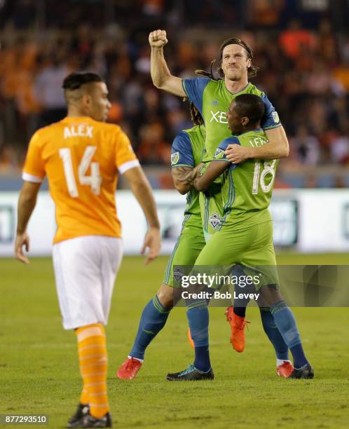 Gustav Svensson of Seattle Sounders celebrates with Kelvin Leerdam and Roman Torres after scoring against the Houston Dynamo in the first half at...