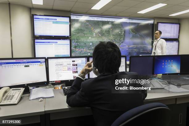 Employees monitor operations at a maintenance control center of China Southern Airlines Co. In Guangzhou, China, on Thursday, Nov. 2, 2017. China...