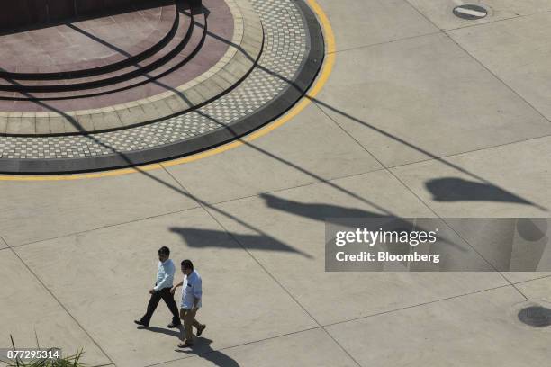 People walk through the Baiyun International Airport in Guangzhou, China, on Thursday, Nov. 2, 2017. China Southern Airlines plans to take advantage...