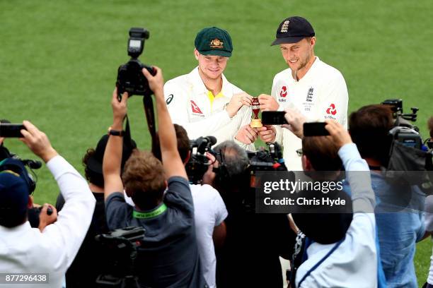 Steve Smith, Captain of Australia and Joe Root, Captain of England pose during a media opportunity ahead of the 2017/18 Ashes Series beginning...