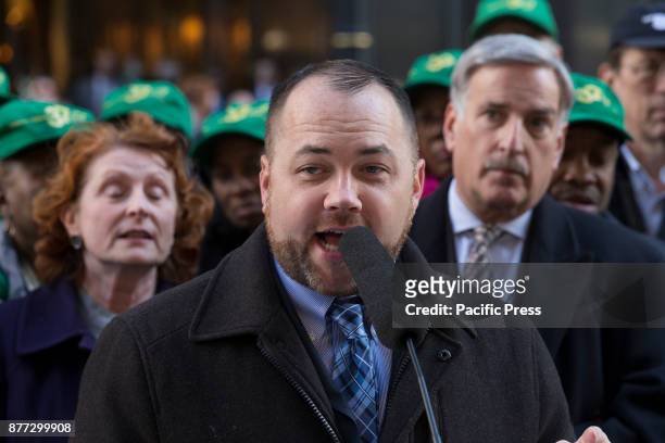 Council member Corey Johnson speaks at rally against GOP tax bill in front of Trump Tower on 5th Avenue.