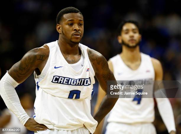 Marcus Foster and Ronnie Harrell Jr. #4 of the Creighton Bluejays walk off the court during a timeout in the National Collegiate Basketball Hall Of...