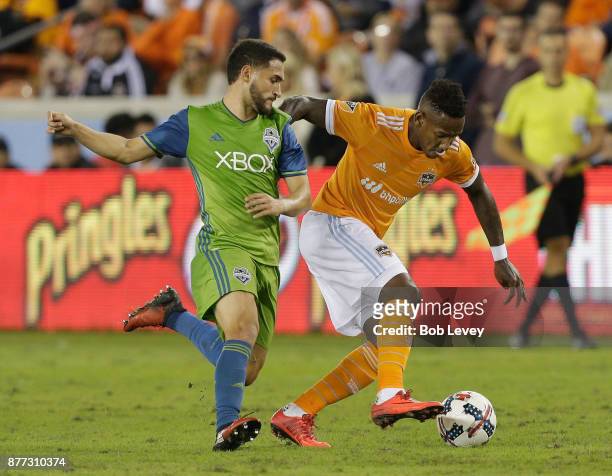 Alberth Elis of Houston Dynamo fends off Cristian Roldan of Seattle Sounders as he brings the ball up the field in the second half at BBVA Compass...