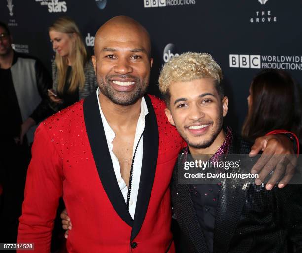 Former NBA player/coach Derek Fisher and singer Jordan Fisher pose at "Dancing with the Stars" season 25 finale at The Grove on November 21, 2017 in...