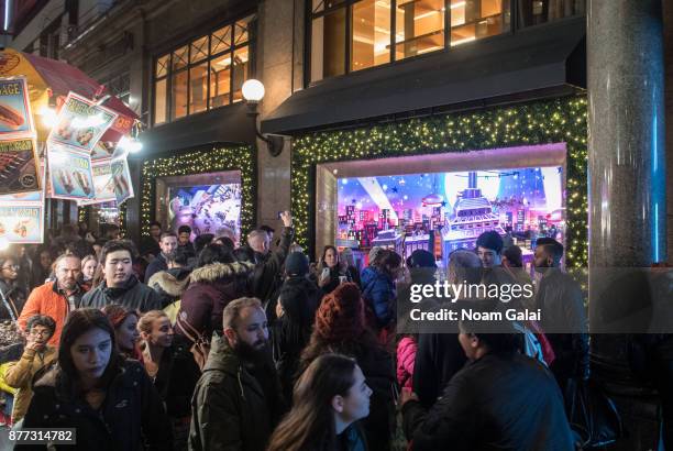 Visitors are seen outside Macy's on November 21, 2017 in New York City.
