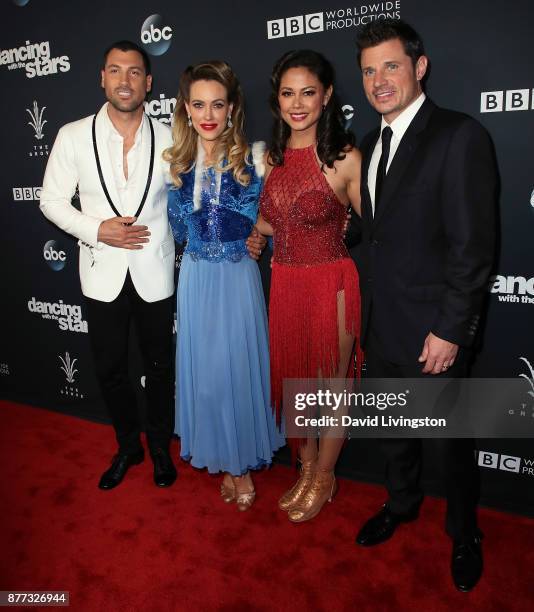 Dancer Maksim Chmerkovskiy, wife dancer Peta Murgatroyd, TV personality Vanessa Lachey and husband singer Nick Lachey pose at "Dancing with the...