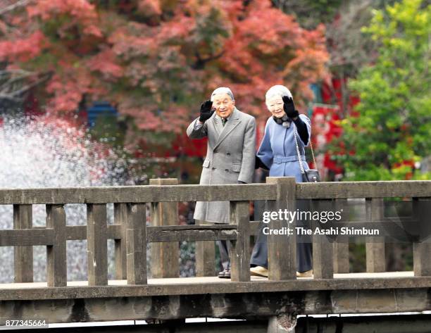 Emperor Akihito and Empress Michiko wave during their visit to Inokashira Park on November 22, 2017 in Musashino, Tokyo, Japan.