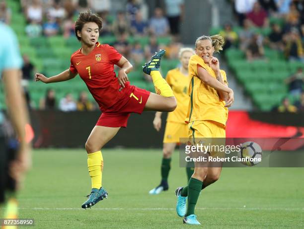 Wang Shuang of ChinaPR challenges Emily van Egmond of the Matildas during the Women's International match between the Australian Matildas and China...
