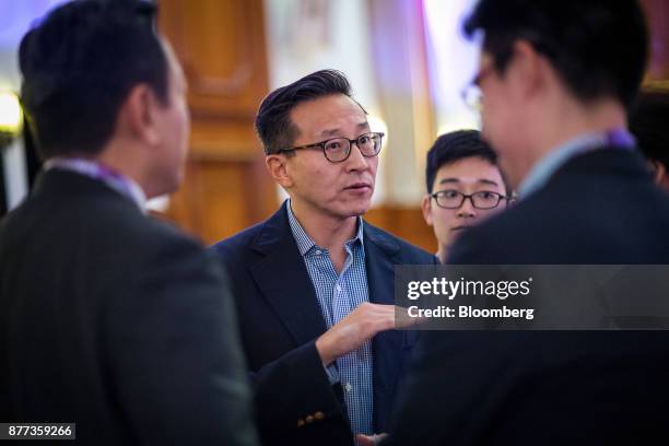 Billionaire Joseph "Joe" Tsai, co-vice chairman of Alibaba Group Holding Ltd., center, speaks with attendees during the Asia Global Dialogue...