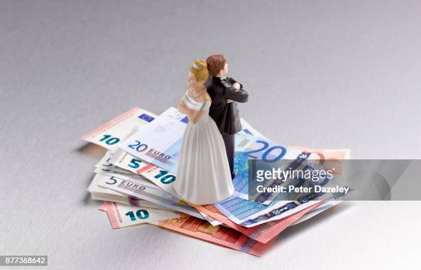 divorced arguing couple on euros - marriage separation stock pictures, royalty-free photos & images