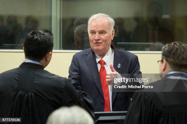 Former Bosnian military chief Ratko Mladic meets his lawyers as he appears for the pronouncement of the Trial Judgement for the International...