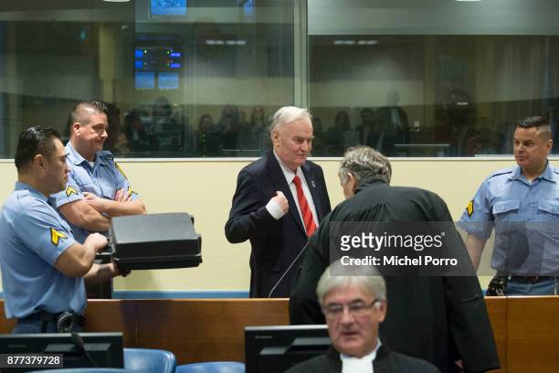 Former Bosnian military chief Ratko Mladic gestures before appearing for the pronouncement of the Trial Judgement for the International Criminal...