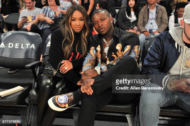 Actress Malika Haqq and rapper O.T. Genasis attend a basketball game between the Los Angeles Lakers and the Chicago Bulls at Staples Center on...