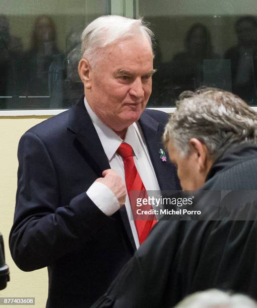Former Bosnian military chief Ratko Mladic gestures before appearing for the pronouncement of the Trial Judgement for the International Criminal...