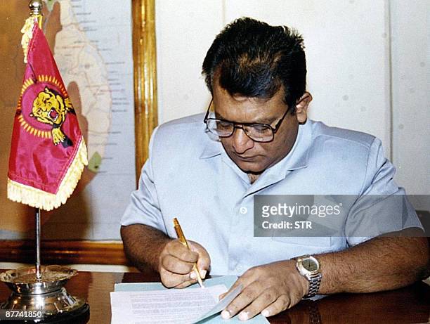 This photograph taken on February 20 shows Sri Lanka's top Tamil Tiger leader Velupillai Prabhakaran signing a historic ceasefire agreement in...