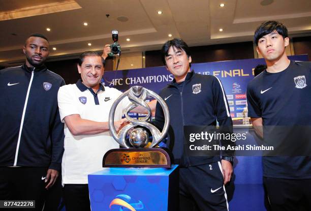 Urawa Red Diamonds head coach Takafumi Hori and Al-Hilal head coach Ramon Diaz shake hands during the official press conference ahead of the AFC...