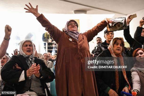 Victims' relatives react as they watch a live TV broadcast from the International Criminal Tribunal for the former Yugoslavia in a room at the...