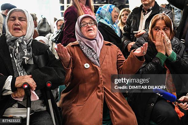 Victims' relatives react as they watch a live TV broadcast from the International Criminal Tribunal for the former Yugoslavia in a room at the...