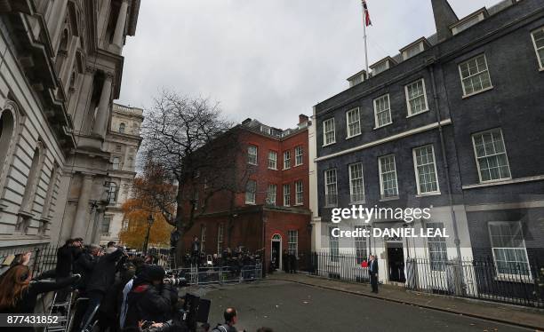 British Chancellor of the Exchequer Philip Hammond poses for pictures with the Budget Box as he leaves 11 Downing Street in London, on November 22...