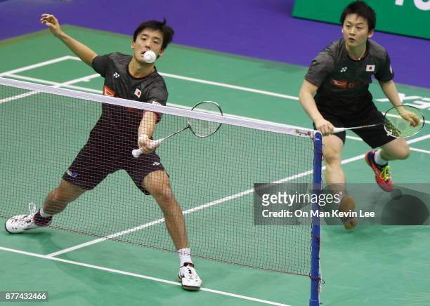 Yuki Fukushima and Sayaka Hirota of Japan in action against Maiken Fruergaard and Sara Thygesen of Denmark during Round 1 of Men's Double on Day 2 of...