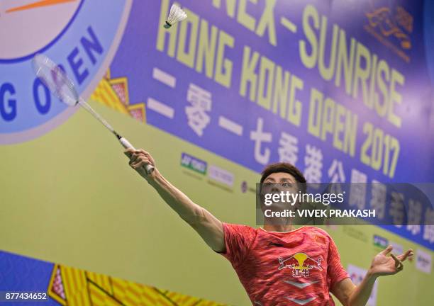 China's Shi Yuqi hits a shot against Denmark's Hans-Kristian Vittinghus during their first round men's singles match at the Hong Kong Open badminton...