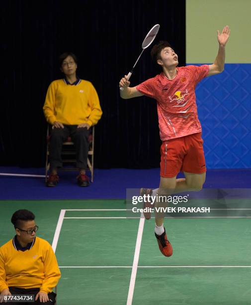 China's Shi Yuqi hits a shot against Denmark's Hans-Kristian Vittinghus during their first round men's singles match at the Hong Kong Open badminton...