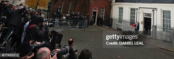 British Chancellor of the Exchequer Philip Hammond poses for pictures with the Budget Box as he leaves 11 Downing Street in London, on November 22...