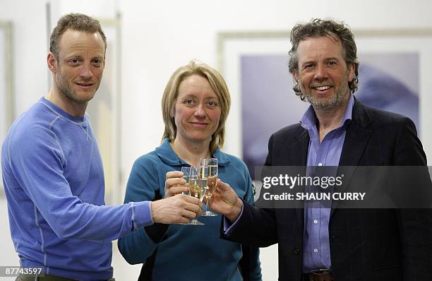 British explorer Pen Hadow and fellow explorers Ann Daniels and Martin Hartley pose for photographers at the Catlin Arctic Survey Headquarters in...