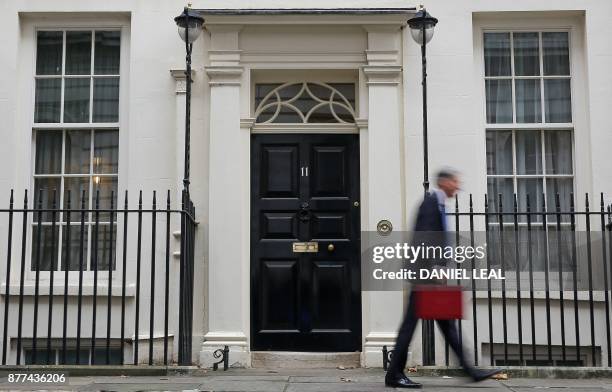 British Chancellor of the Exchequer Philip Hammond carries the Budget Box as he leaves 11 Downing Street in London, on November 22 before presenting...