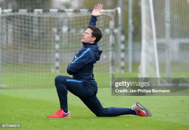 Fitnesstrainer Henrik Kuchno of Hertha BSC stretches during the training on november 22, 2017 in Berlin, Germany.