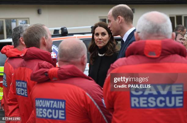 Britain's Prince William, Duke of Cambridge, and Britain's Catherine, Duchess of Cambridge, meet member of the Mountain and Cave Rescue services...