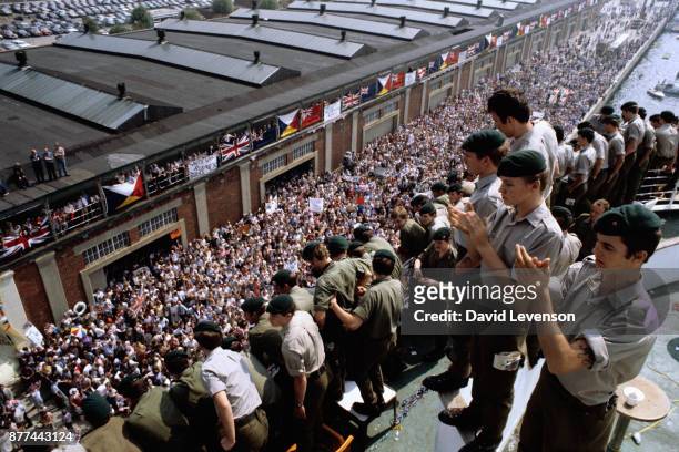 Crowds of family and civilians welcome the return of Royal Marines aboard the SS Canberra, as it docks in Southampton on July 11 on their return from...