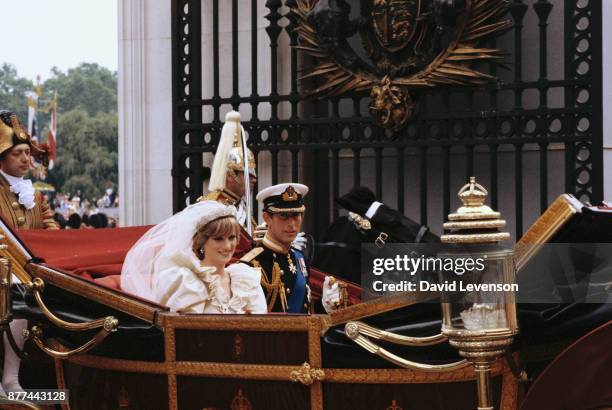 Diana, Princess of Wales and Prince Charles ride in a carriage after their wedding at St. Paul's Cathedral July 29, 1981 in London.