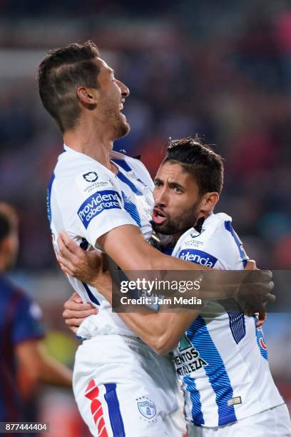 Omar Gonzalez of Pachuca celebrates with teammate Jonathan Urretaviscaya after scoring the first goal of his team during the semifinal match between...