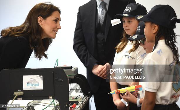 Britain's Catherine, Duchess of Cambridge, talks with school children from Topcliffe Primary School winners of the Jaguar Primary School Challenge -...