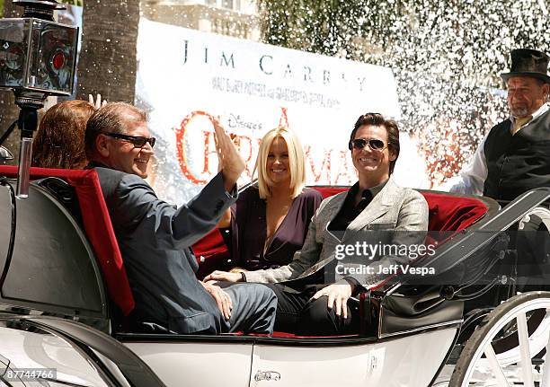 Director Robert Zemeckis, Jenny McCarthy and actor Jim Carrey attend Walt Disney's 'A Christmas Carol' Photo Call and Press Conference at the Carlton...