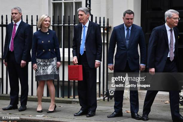 Economic Secretary to the Treasury Stephen Barclay, Chief Secretary to the Treasury Elizabeth Truss stands with Britain's Chancellor of the Exchequer...