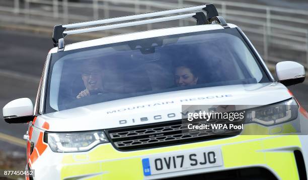 Prince William, Duke of Cambridge and Catherine, Duchess of Cambridge drive a Land Rover Discovery as they takes part in an off-road driving...