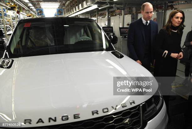 Prince William, Duke of Cambridge and Catherine, Duchess of Cambridge tour the Range Rover production line during their visit to Jaguar Land Rover's...